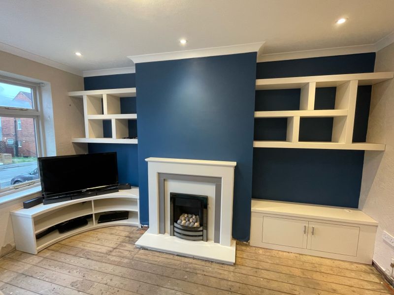 Concave TV cab with floating shelving and alcove cabinet. : Swipe To View More Images
